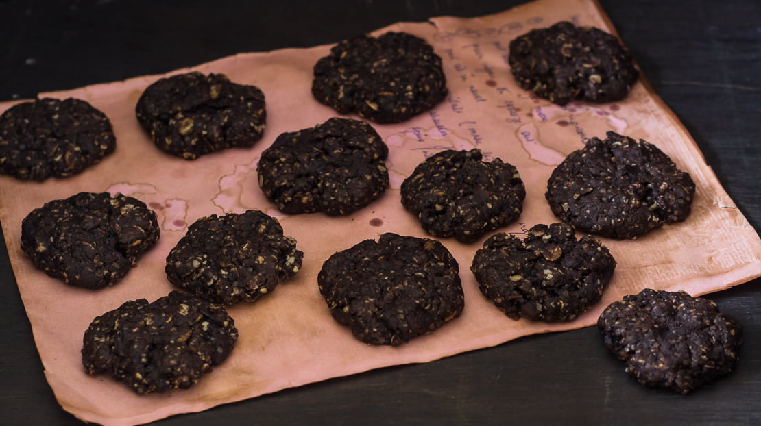 Healthy oatmeal cookies with chocolate chips on a rustic wooden plate
