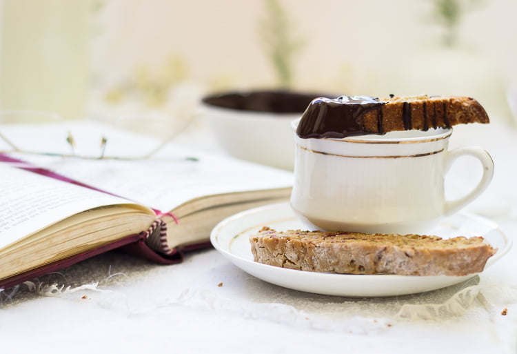 Close-up of crispy biscotti slices with candied ginger and dried cherries