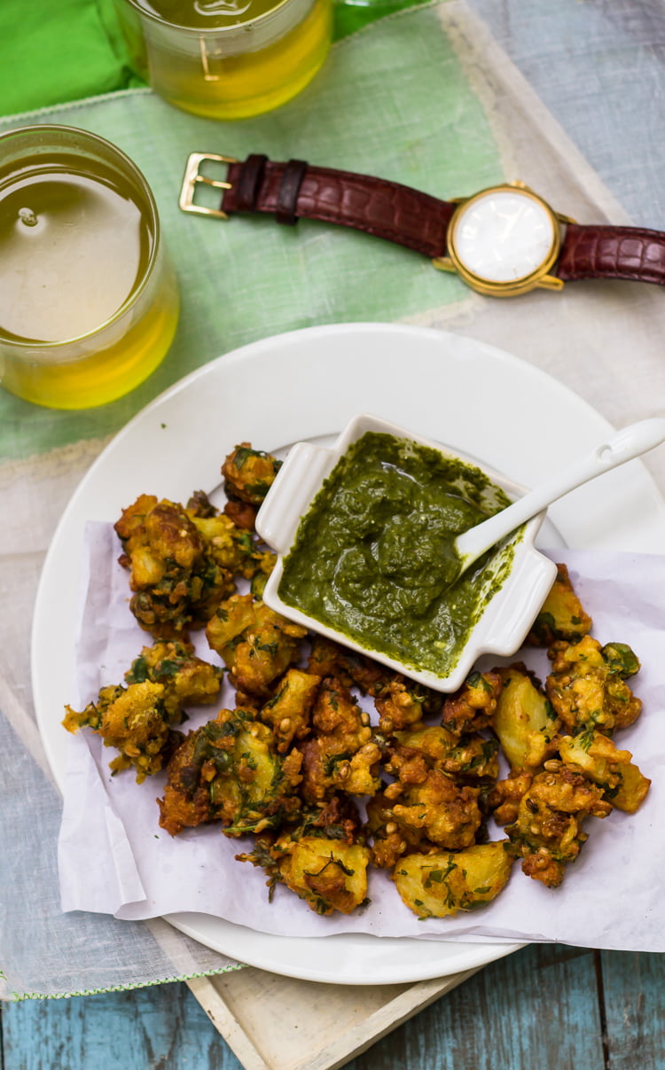 Freshly fried Aloo Bread Pakoris draining on a paper towel