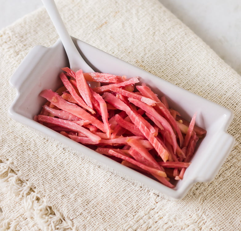 Homemade pickled ginger in a ceramic bowl
