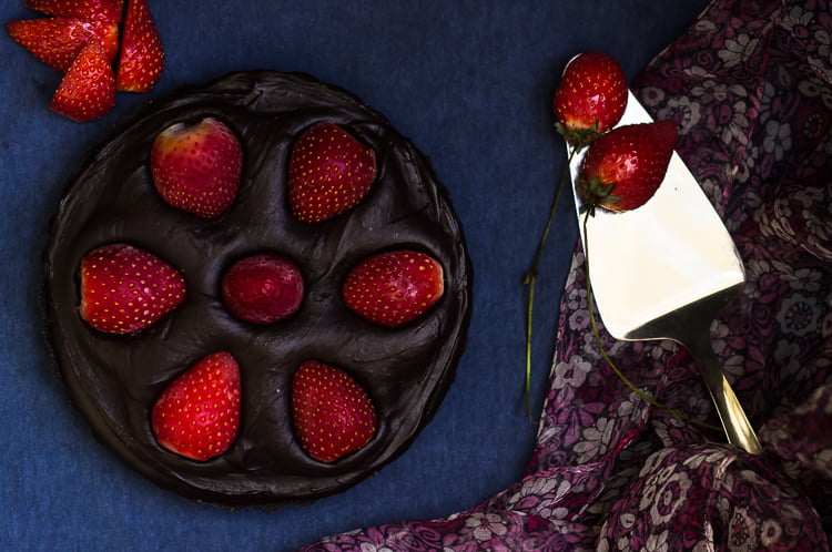 Close-up of fresh strawberry arrangement on top of the chocolate tart