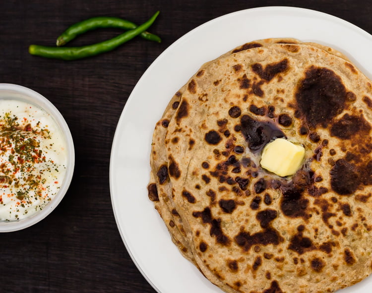 Freshly made matar ka paratha served hot