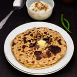Green peas paratha with butter topping