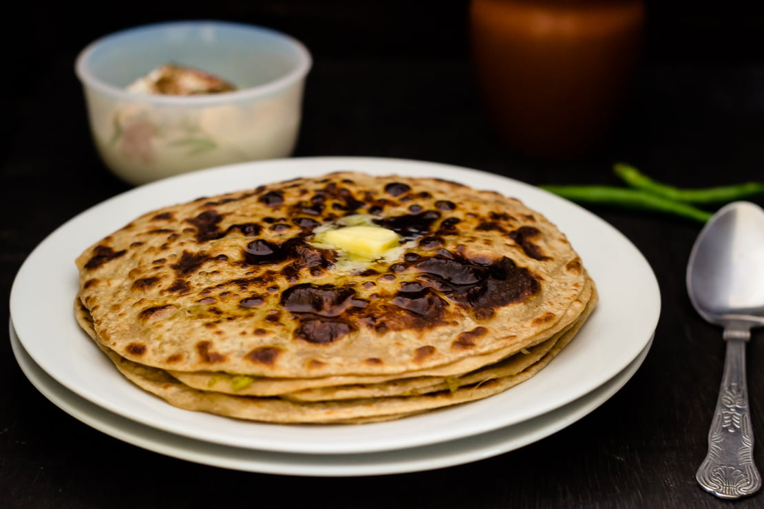 Matar paratha served with curd and pickle