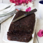 Whole loaf of double chocolate zucchini bread with chocolate chips on top
