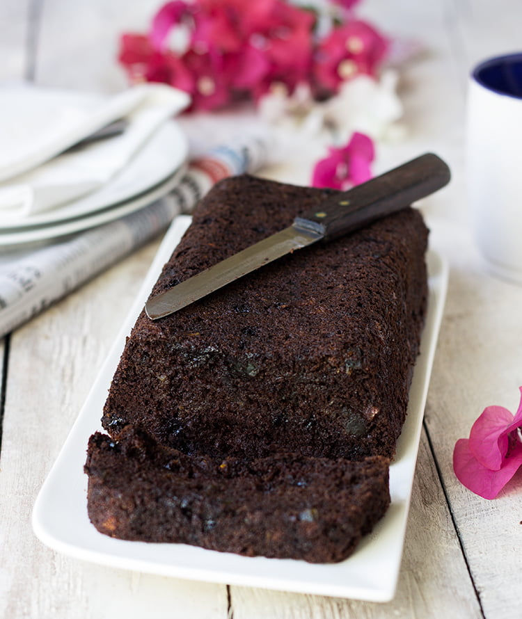 Sliced double chocolate zucchini bread on a wooden board