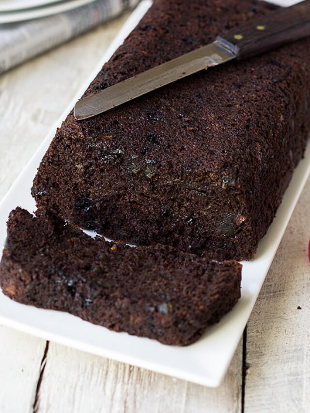 Sliced double chocolate zucchini bread on a wooden board