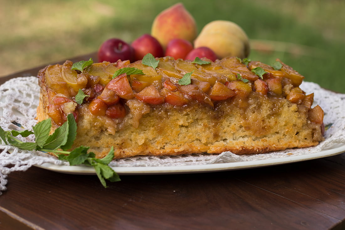 Peach and plum upside-down cake with a glossy caramelized fruit glaze