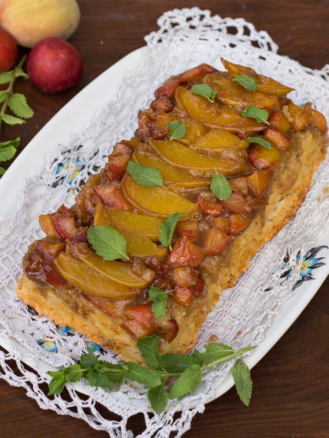 Golden peach and plum upside-down cake with caramelized fruit topping