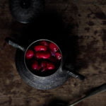 Overhead view of cherry compote in a glass container