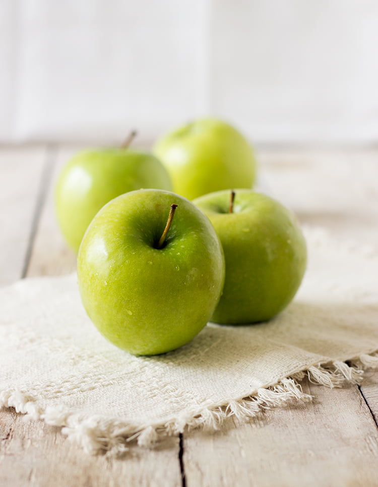 A step-by-step process of making eggless caramel apple upside-down cake