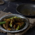 Close-up of pickled okra pieces showing texture and spice infusion