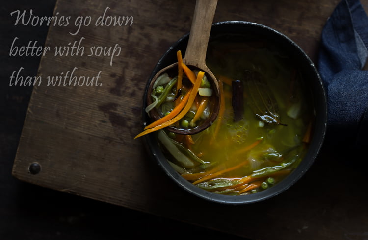 Soup pot filled with simmering mixed vegetables in flavorful broth