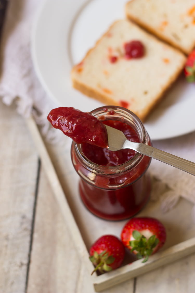 Spoonful of homemade strawberry jam with chunks of fruit