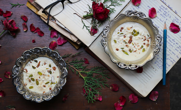 Close-up of a bowl of Malai Rabri with rich, creamy texture and sprinkled with chopped pistachios