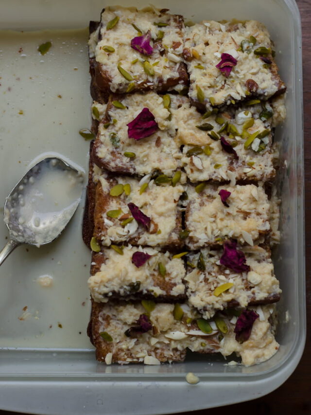 A plate of Authentic Shahi Tukda garnished with chopped pistachios and almonds