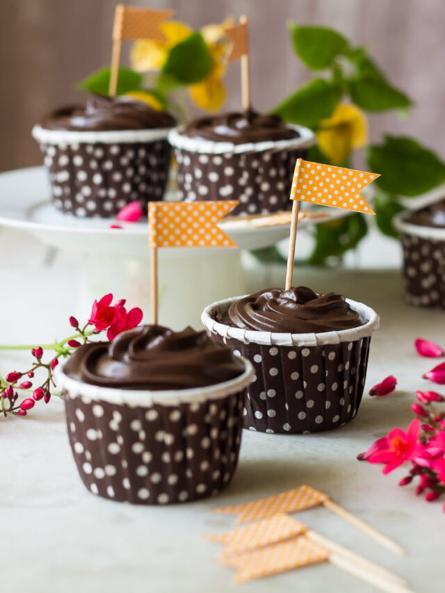 Eggless chocolate truffle cupcakes topped with glossy ganache