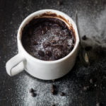 Easy mug brownie with chocolate drizzle on top.