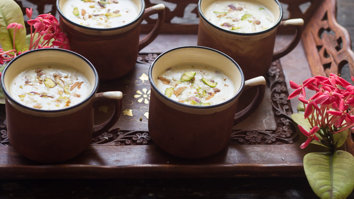 A beautifully presented bowl of Gur ki Kheer topped with chopped nuts