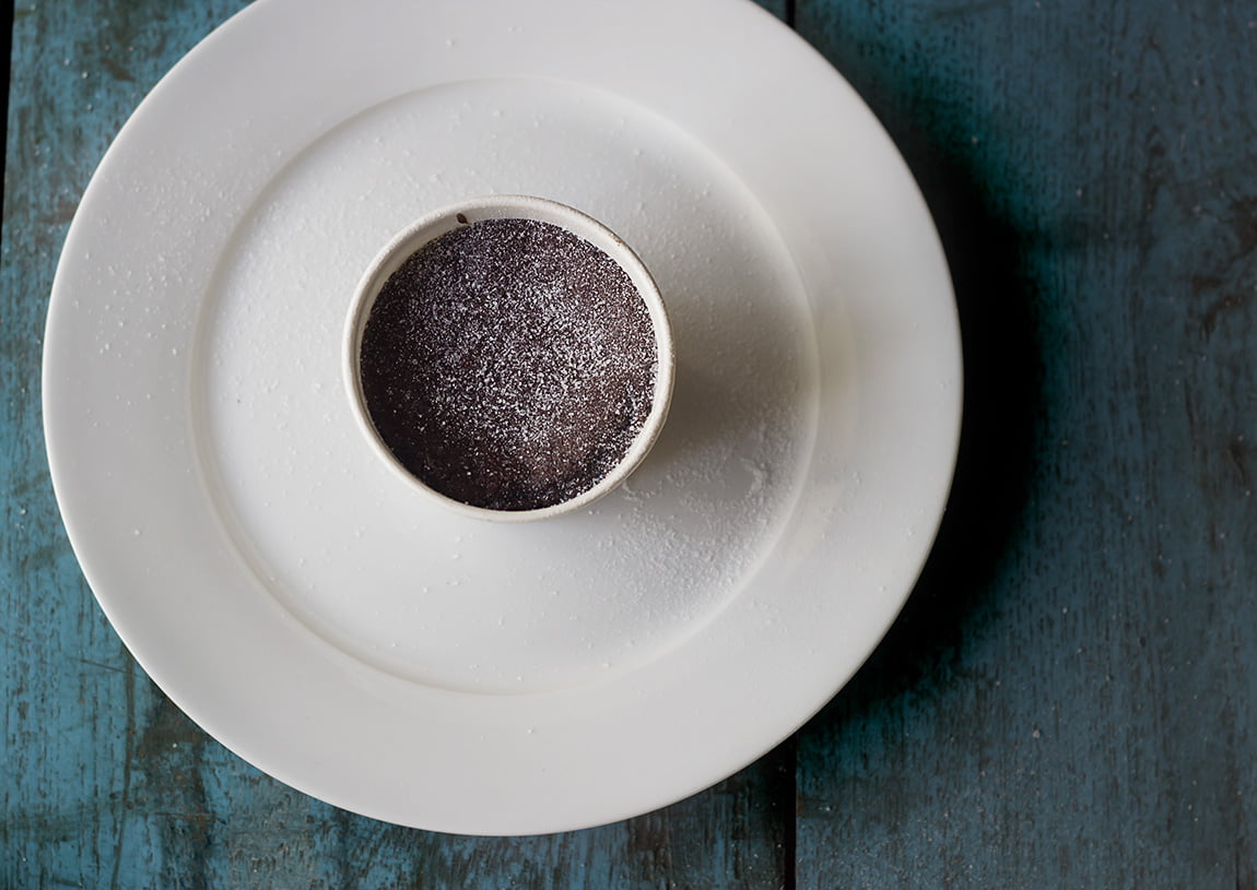 Freshly baked eggless lava cake on plate