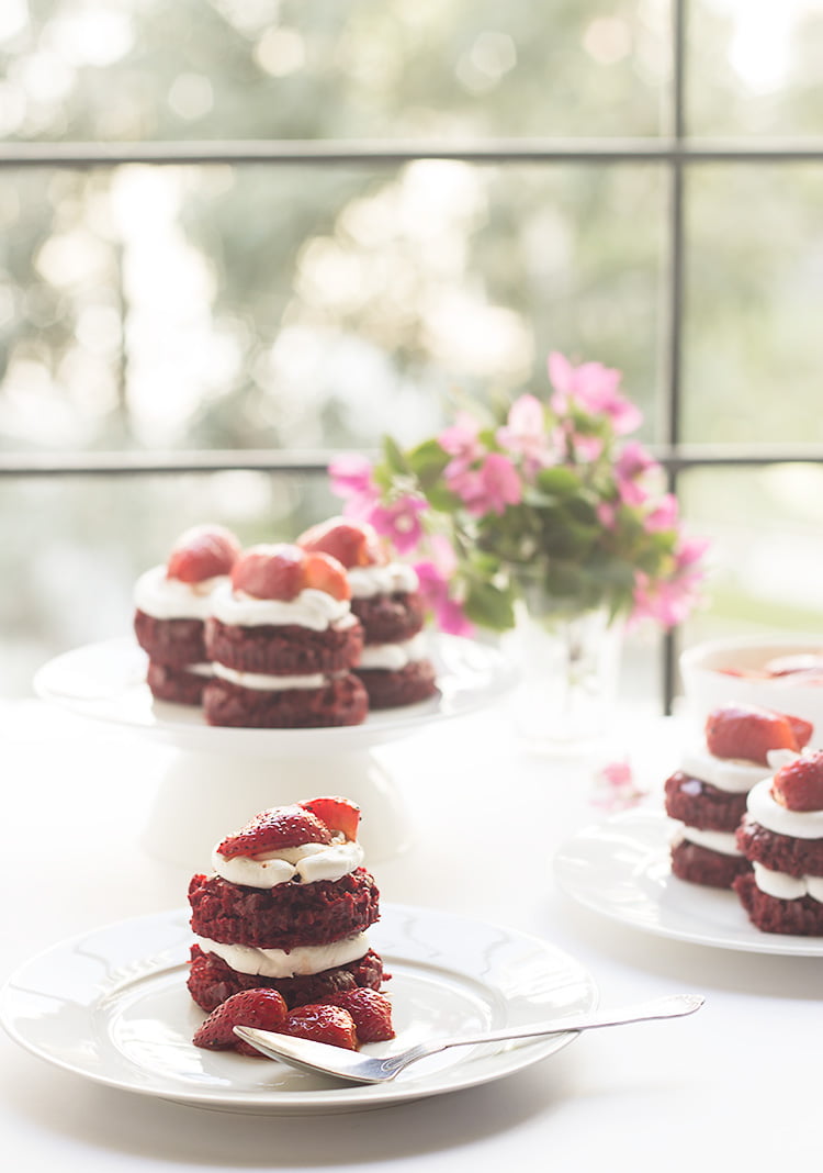 Close-up of a freshly baked eggless red velvet mini cake with cream cheese frosting