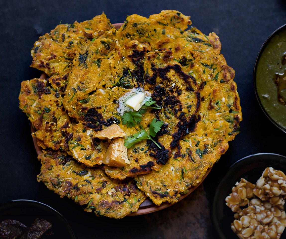 Stack of Makke ke Paranthe served with dollops of white butter