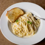 Close-up of cheese pasta with smooth and glossy sauce