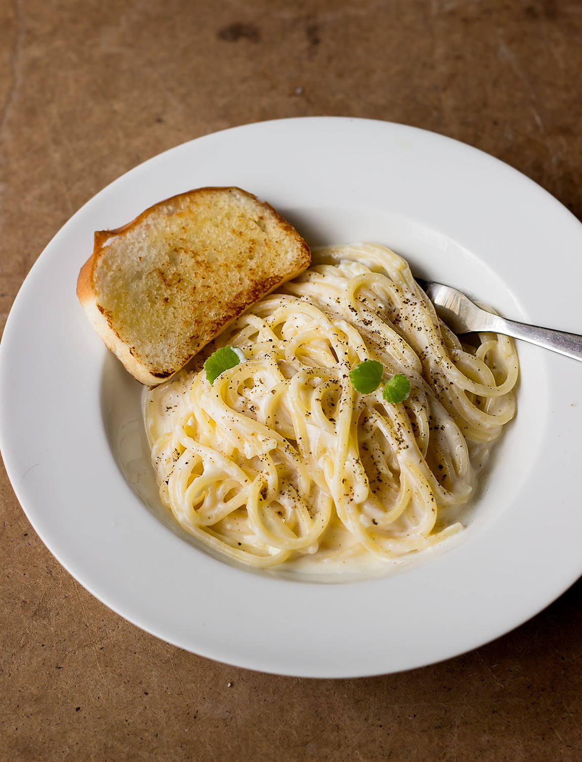 Close-up of cheese pasta with smooth and glossy sauce