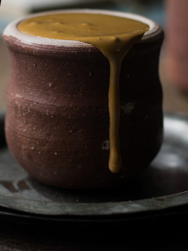 Close-up of frothy hand-beaten coffee in a small cup