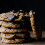 A close-up of rich, dark chocolate chunks embedded in a cookie