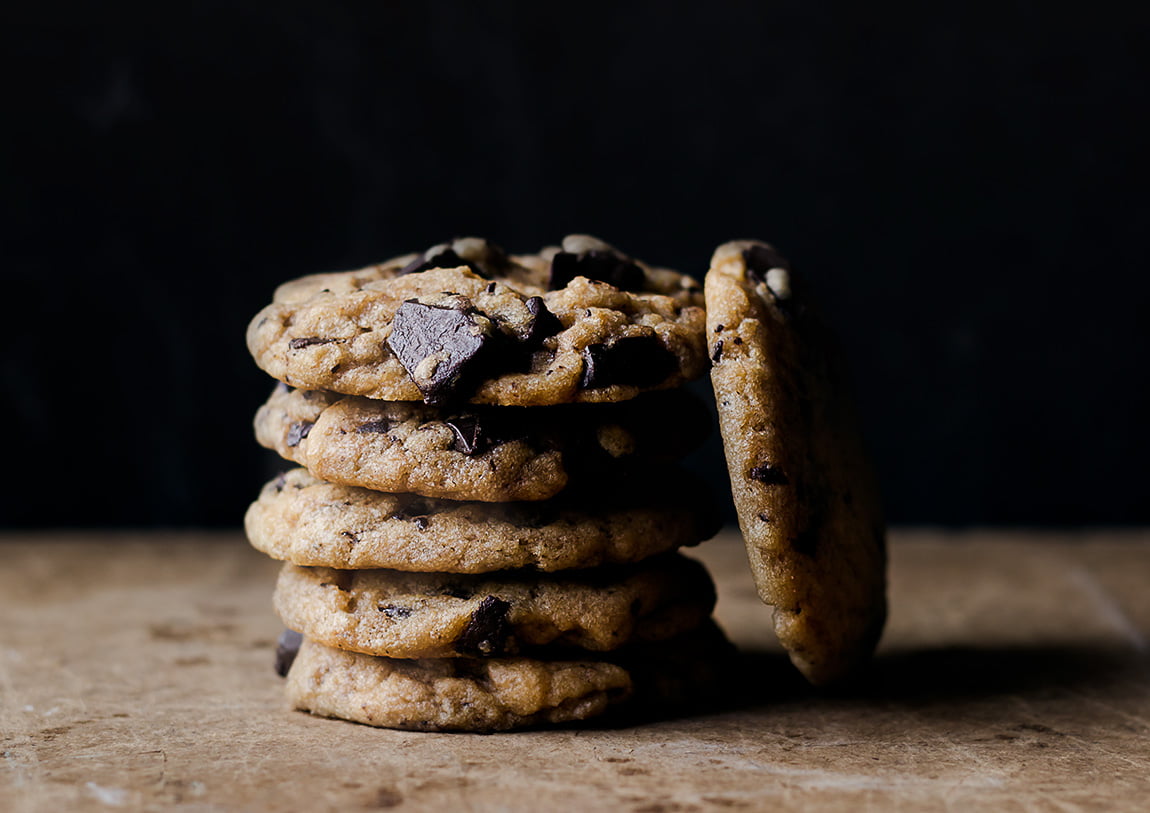A cookie with slightly crisp edges and a soft center, loaded with chocolate