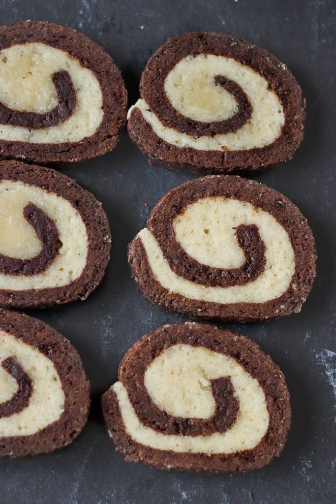 Sliced pinwheel cookies arranged neatly on a baking tray