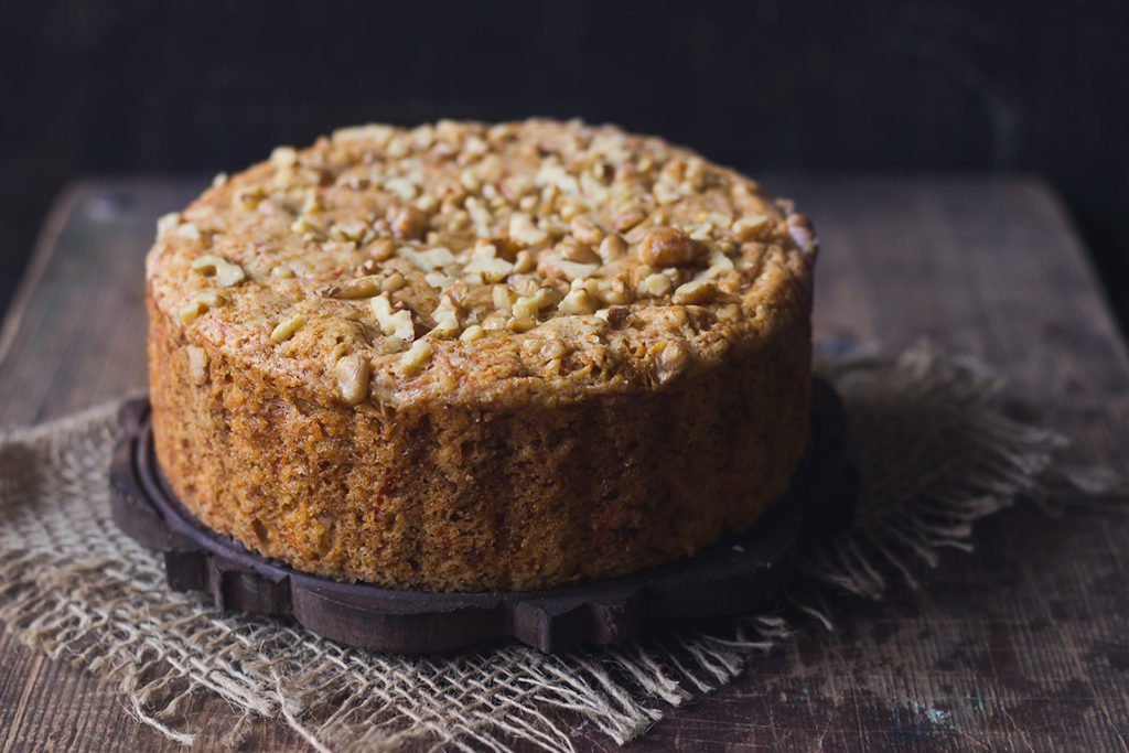 Carrot cinnamon cake fresh out of the oven, cooling on a wire rack