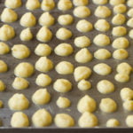 Moong Dal Mangodi spread in a tray in a circular shape