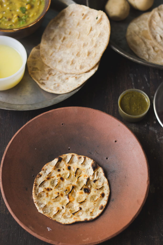Traditional Angakadi roti served on a plate with ghee drizzle