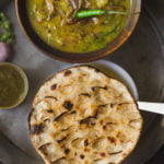 Traditional Angakadi roti served on a plate with ghee drizzle