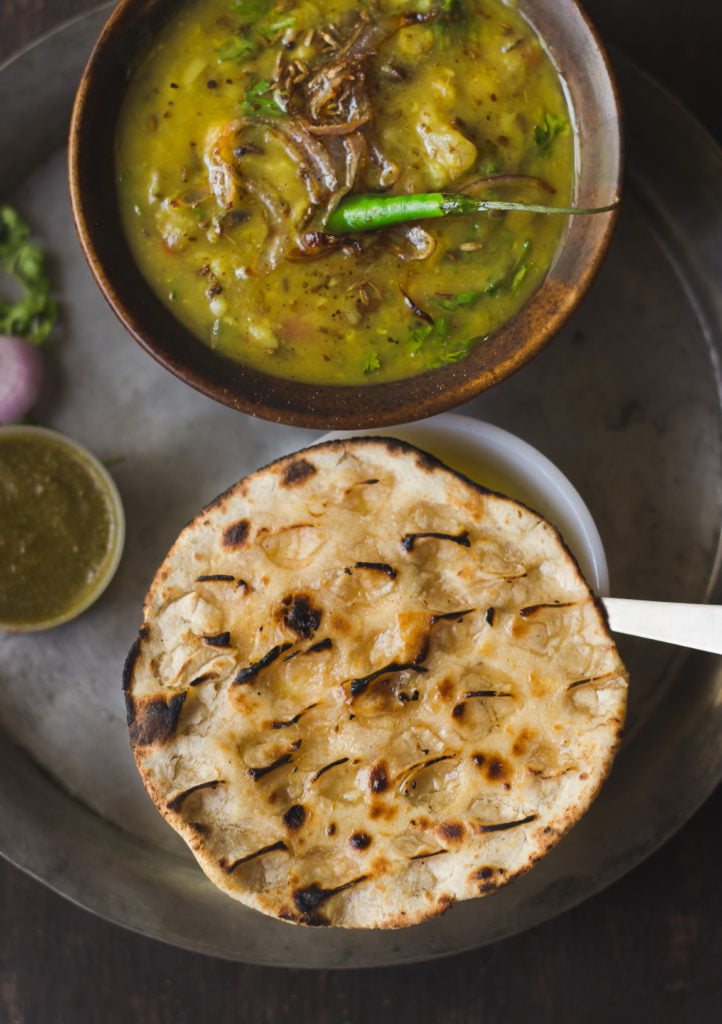 Close-up of Rajasthani Khoba Roti showing detailed pinched patterns
