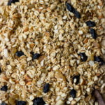 A healthy granola mix spread on a tray before going into the oven