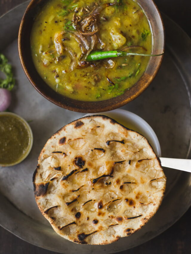 Traditional Angakadi roti served on a plate with ghee drizzle