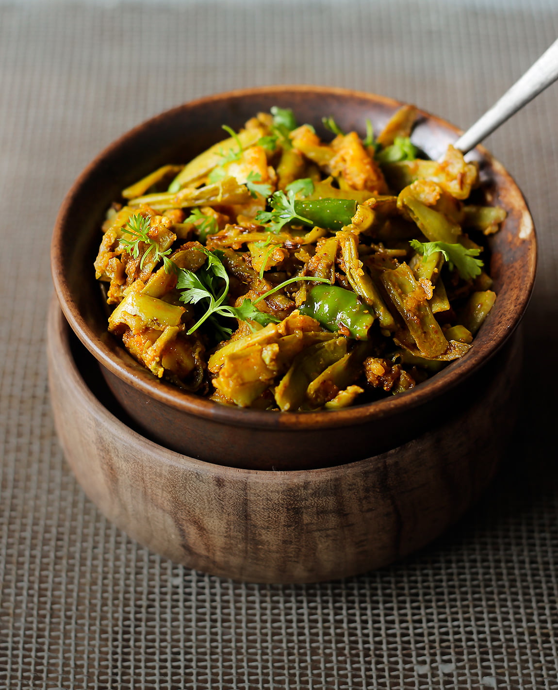 Fresh coriander leaves sprinkled on top of Gawar Phali Ki Sabji for garnish