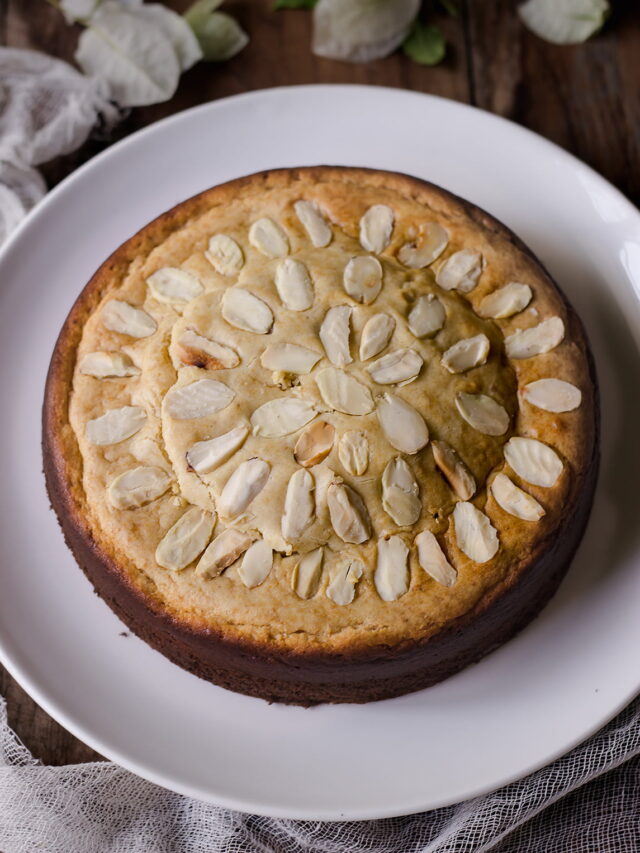 A beautifully plated Eggless Mawa Cake on a marble countertop