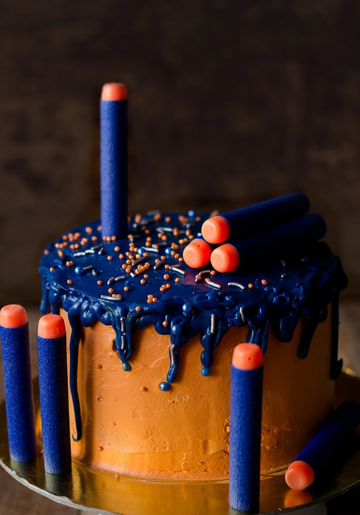 Detailed close-up of an Eggless Nerf Gun Cake showcasing intricate fondant work and vibrant colors