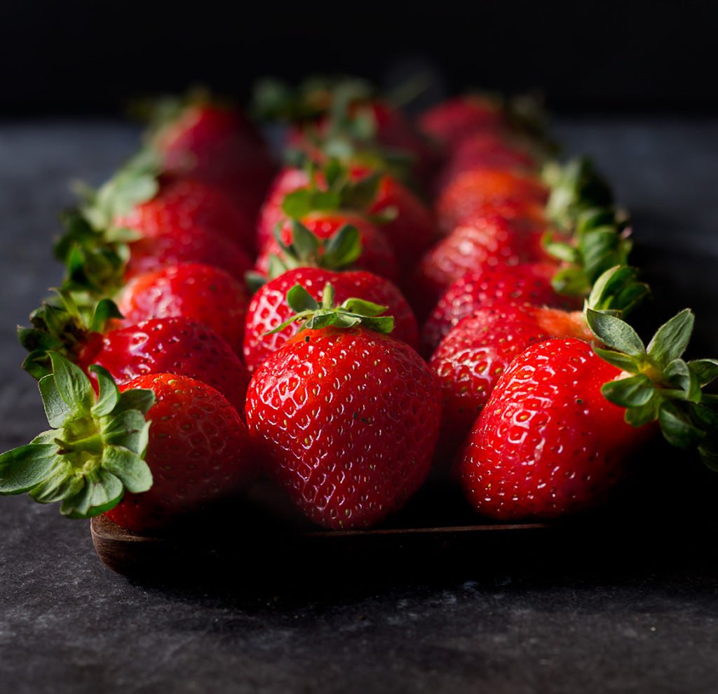 Close-up view of strawberries arranged on a table