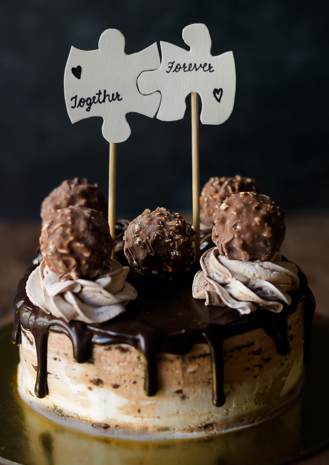 A beautifully decorated Eggless Ferrero Rocher Cake topped with whipped cream