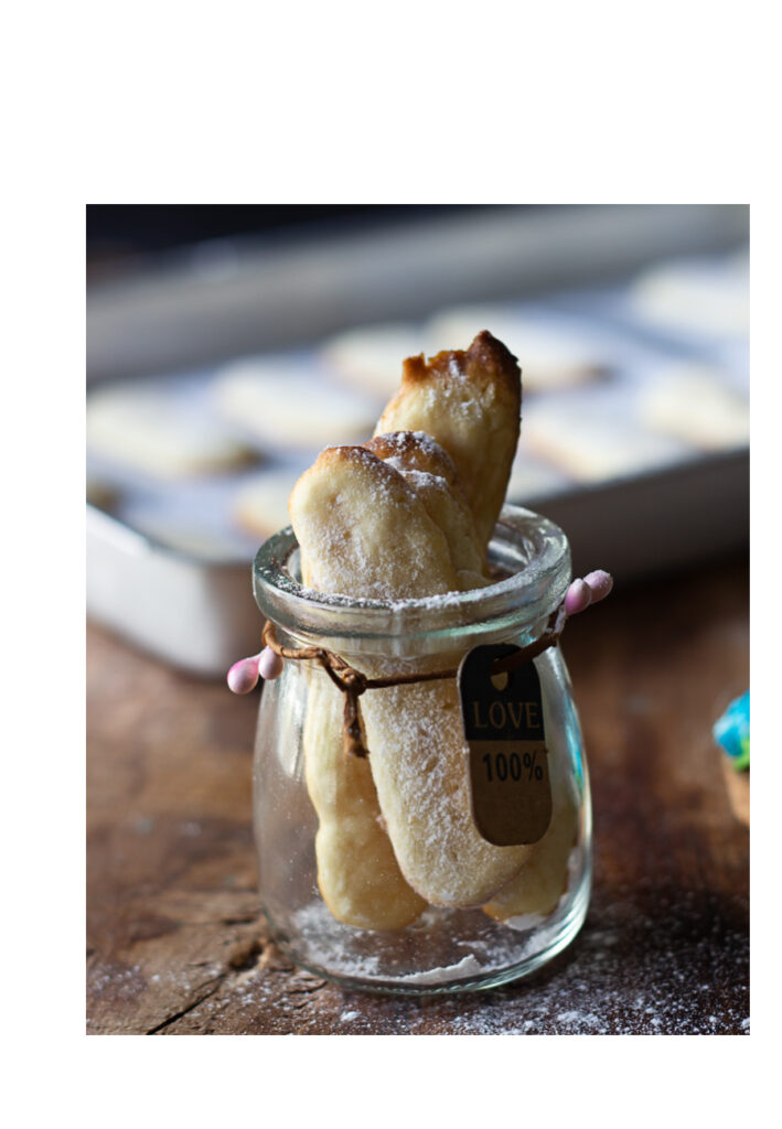 Close-up of Eggless Savoiardi biscuits kept in a jar