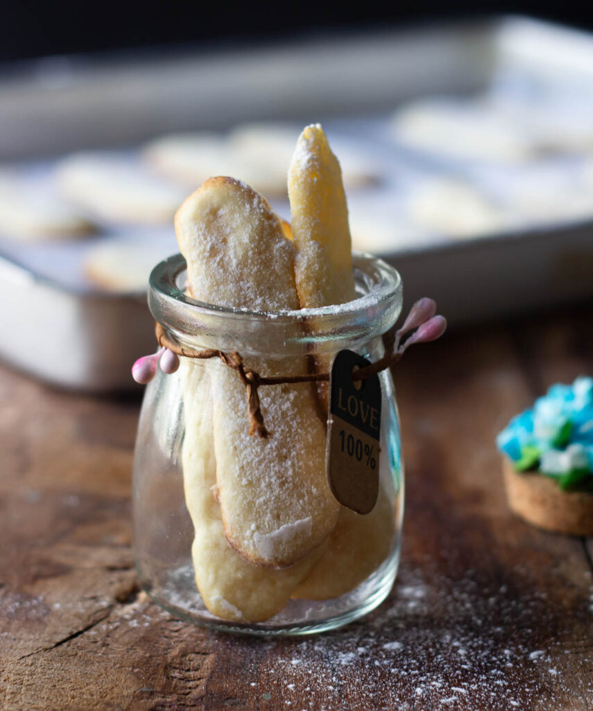 Freshly baked Eggless Lady Fingers in a jar