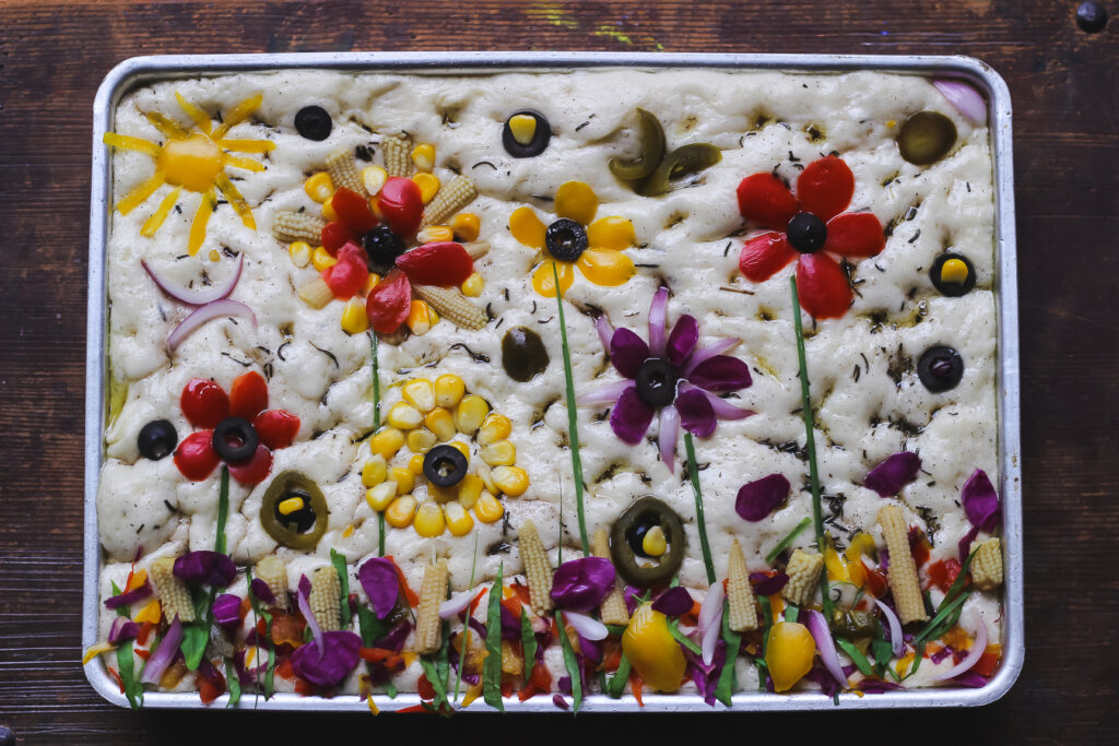 Close-up of the colorful vegetable designs on top of the garden focaccia