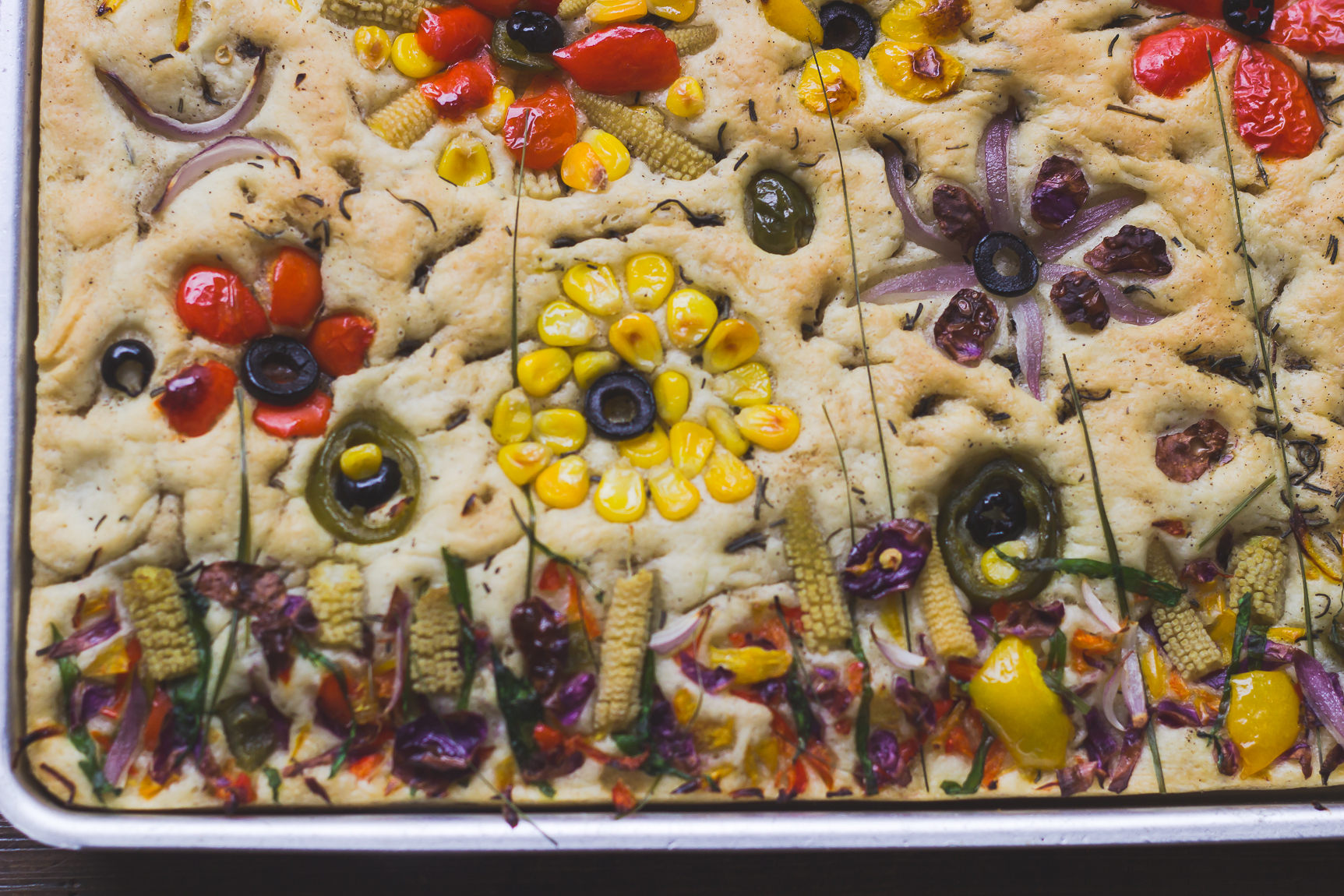 A table setting with garden focaccia as the centerpiece