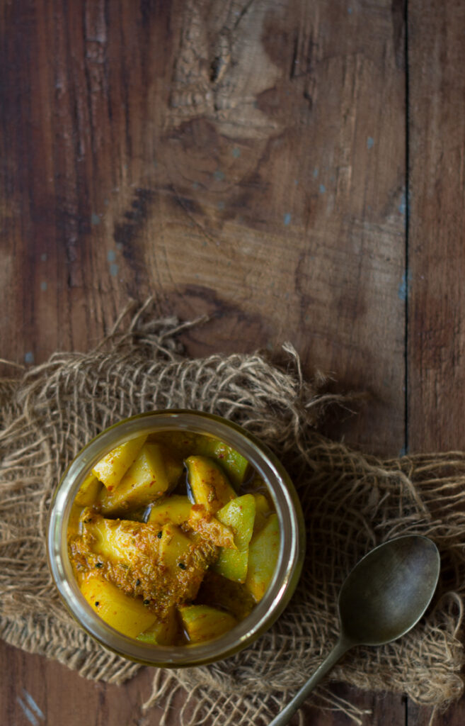Top-view of spicy and tangy mango pickle in a jar