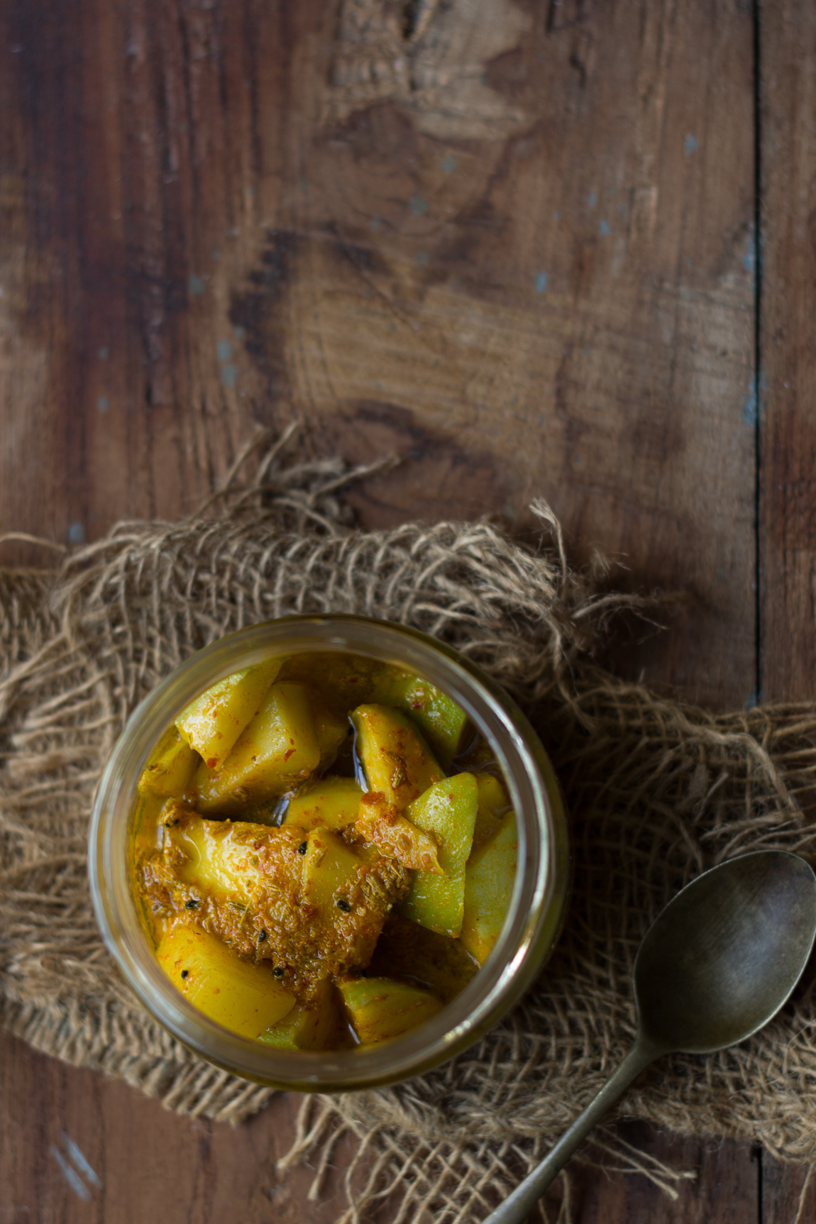 Top-view of spicy and tangy mango pickle in a jar